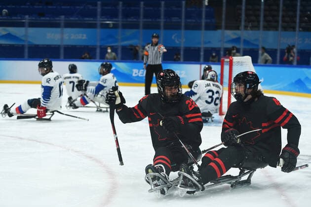 (220308) -- BEIJING, March 8, 2022 -- Garrett Riley (L, front) of Canada celebrates with James Dunn (R, front) after scoring during the Preliminary Round Group A Match of Para Ice hockey, Eishockey between Canada and South Korea at Beijing 2022 Winter Paralympic Games in Beijing, capital of China, March 8, 2022. ) (SP)CHINA-BEIJING-WINTER PARALYMPICS-PARA ICE HOCKEY-GROUP A-CAN VS KOR(CN) RenxChao 
