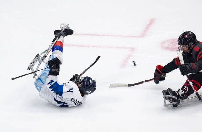 (220308) -- BEIJING, March 8, 2022 -- Jung Seung Hwan (L) of South Korea vies with Rob Armstrong of Canada during the Preliminary Round Group A Match of Para Ice hockey, Eishockey between Canada and South Korea at Beijing 2022 Winter Paralympic Games in Beijing, capital of China, March 8, 2022. ) (SP)CHINA-BEIJING-WINTER PARALYMPICS-PARA ICE HOCKEY-GROUP A-CAN VS KOR(CN) CaixYang 