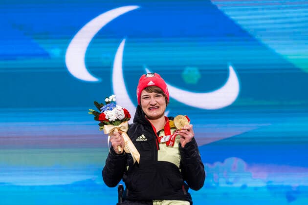 Yanqing China Medal Plaza 08 03 2022 Para Alpine Skiing FORSTER, Anna Lena GER from BRSV Radolfzell BAD cheers on winning the gold medal at the award ceremony in the Women™s Super Combined competition, downhill and slalom Credit Mika Volkmann.