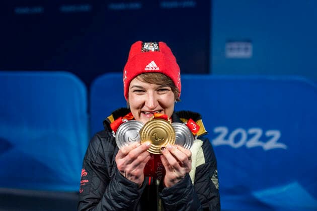 Yanqing China Medal Plaza 08 03 2022 Para Ski Alpin FORSTER, Anna Lena GER from BRSV Radolfzell BAD cheers about winning the gold medal at the award ceremony in the Women™s Super Combined competition, downhill and slalom Afterwards she shows her other two silver medals Credit Mika Volkmann