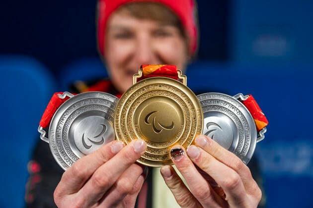 Yanqing China Medal Plaza 08 03 2022 Para Ski Alpin FORSTER, Anna Lena GER from BRSV Radolfzell BAD cheers about winning the gold medal at the award ceremony in the Women™s Super Combined competition, downhill and slalom Afterwards she shows her other two silver medals Credit Mika Volkmann