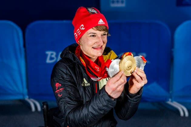 Yanqing China Medal Plaza 08 03 2022 Para Ski Alpin FORSTER, Anna Lena GER from BRSV Radolfzell BAD cheers about winning the gold medal at the award ceremony in the Women™s Super Combined competition, downhill and slalom Afterwards she shows her other two silver medals Credit Mika Volkmann