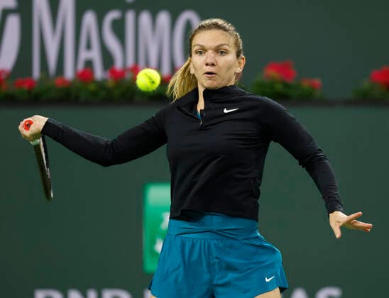 March 08, 2022 Simona Halep of Romania returns a shot against Aryna Sabalenka of Belarus during the Eisenhower Cup of the 2022 BNP Paribas Open at Indian Wells Tennis Garden in Indian Wells, California. Mandatory Photo Credit : CSM. Indian Wells United States of America - ZUMAc04_ 20220308_zaf_c04_172 Copyright: xCharlesxBausx