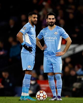 Football - 2021 2022 UEFA Champions League - Round of Sixteen - Second Leg - Manchester City vs Sporting Lisbon - Etihad Stadium - Wednesday 9th March 2022 Riyad Mahrez and Ilkay Gundogan of Manchester City stand over a free kick, at the Etihad. 