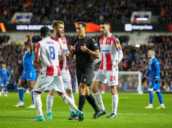Mandatory Credit: Photo by Stuart Wallace Shutterstock (12843073y) Referee Serdar Gozubuyuk surrounded by Crevna Zvezda players after awarding Rangers a penalty kick following a VAR check. Rangers v Red Star Belgrade, Europa League, Round of 16, First Leg, Football, Ibrox Stadium, Glasgow, UK - 10 Mar 2022 EDITORIAL USE ONLY No use with unauthorised audio, video, data, fixture lists, club league logos or live services. Online in-match use limited to 120 images, no video emulation. No use in betting, games or single club league player publications. Rangers v Red Star Belgrade, Europa League, Round of 16, First Leg, Football, Ibrox Stadium, Glasgow, UK - 10 Mar 2022 EDITORIAL USE ONLY No use with unauthorised audio, video, data, fixture lists, club league logos or live services. Online in-match use limited to 120 images, no video emulation. No use in betting, games or single club league player publications. Copyright: xStuartxWallace Shutterstockx 12843073y