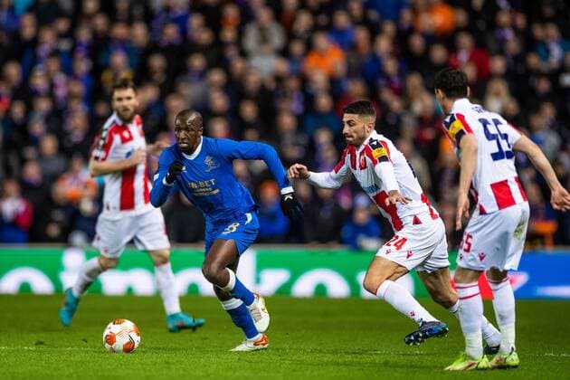 Mandatory Credit: Photo by Kirk O Rourke Rangers FC Shutterstock (12843268ek) Glen Kamara of Rangers ships past Cristiano Piccini of Red Star Belgrade during the Europa League match at Ibrox Stadium, Glasgow. Rangers v Red Star Belgrade, Europa League, Round of 16, First Leg, Football, Ibrox Stadium, Glasgow, UK - 10 Mar 2022 EDITORIAL USE ONLY No use with unauthorised audio, video, data, fixture lists, club league logos or live services. Online in-match use limited to 120 images, no video emulation. No use in betting, games or single club league player publications. Rangers v Red Star Belgrade, Europa League, Round of 16, First Leg, Football, Ibrox Stadium, Glasgow, UK - 10 Mar 2022 EDITORIAL USE ONLY No use with unauthorised audio, video, data, fixture lists, club league logos or live services. Online in-match use limited to 120 images, no video emulation. No use in betting, games or single club league player publications. Copyright: xKirkxO Rourke RangersxFC Shutterstockx 12843268ek
