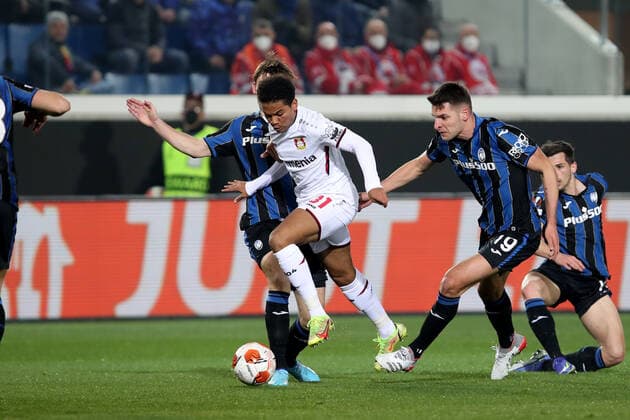 BERGAMO, ITALY - MARCH 10: Amine Adli striker Bayer 04 Leverkusen fights for the ball with Marten de Roon midfielder for Atalanta B.C. Berat Djimsiti defender for Atalanta B.C. during the Europa League football match between Atalanta and Leverkusen at Gewiss Stadium on March 10, 2022 in Bergamo, Italy. (Photo by Stefano Nicoli Speed Media Icon Sportswire) SOCCER: MAR 10 Europa League - Leverkusen at Atalanta Icon220310024