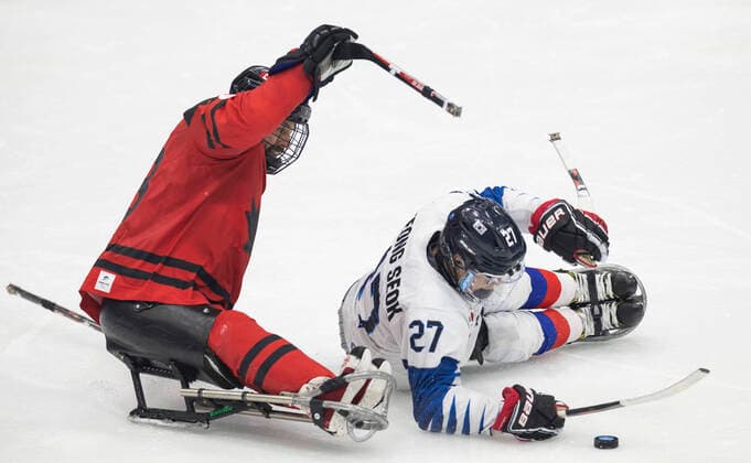 (220311) -- BEIJING, March 11, 2022 -- Cho Byeong Seok (R) of South Korea competes during the para Ice hockey, Eishockey semifinal match between Canada and South Korea of Beijing 2022 Winter Paralympics at National Indoor Stadium in Beijing, March 11, 2022. ) (SP)CHINA-BEIJING-WINTER PARALYMPICS-PARA ICE HOCKEY-SEMIFINAL-CAN VS KOR CaixYang 
