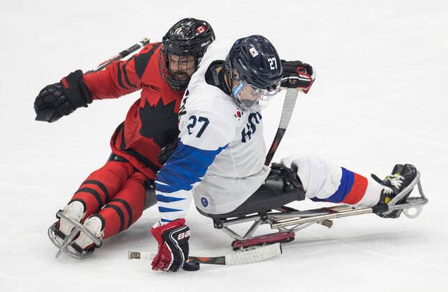 (220311) -- BEIJING, March 11, 2022 -- Cho Byeong Seok (R) of South Korea competes during the para Ice hockey, Eishockey semifinal match between Canada and South Korea of Beijing 2022 Winter Paralympics at National Indoor Stadium in Beijing, March 11, 2022. ) (SP)CHINA-BEIJING-WINTER PARALYMPICS-PARA ICE HOCKEY-SEMIFINAL-CAN VS KOR CaixYang 
