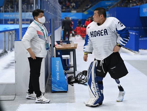 (220311) -- BEIJING, March 11, 2022 -- Choi Hyuk Jun (L) of South Korea is seen before the para Ice hockey, Eishockey semifinal match between Canada and South Korea of Beijing 2022 Winter Paralympics at National Indoor Stadium in Beijing, March 11, 2022. ) (SP)CHINA-BEIJING-WINTER PARALYMPICS-PARA ICE HOCKEY-SEMIFINAL-CAN VS KOR WuxHuiwo 