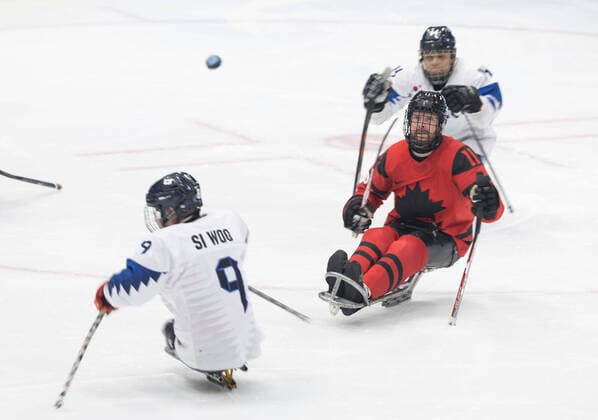 (220311) -- BEIJING, March 11, 2022 -- Adam Dixon (C) of Canada competes during the para Ice hockey, Eishockey semifinal match between Canada and South Korea of Beijing 2022 Winter Paralympics at National Indoor Stadium in Beijing, March 11, 2022. ) (SP)CHINA-BEIJING-WINTER PARALYMPICS-PARA ICE HOCKEY-SEMIFINAL-CAN VS KOR CaixYang 
