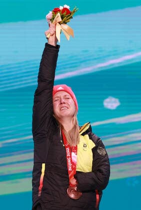 (220311) -- BEIJING, March 11, 2022 -- Bronze medalist Andrea Rothfuss of Germany reacts during the awarding ceremony for the Para Alpine Skiing Women s Giant Slalom Standing of Beijing 2022 Paralympic Winter games, Winterspiele,Spiele, Summer games at Yanqing Medals Plaza in Yanqing District, Beijing, capital of China, March 11, 2022. ) (SP)CHINA-BEIJING-WINTER PARALYMPICS-PARA ALPINE SKIING-WOMEN S GIANT SLALOM-AWARDING CEREMONY(CN) LuoxYuan 