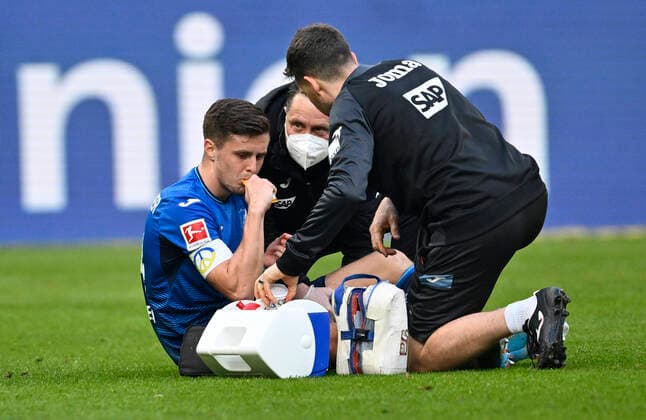 Christoph Baumgartner TSG 1899 Hoffenheim 14 Injury Injured On The Ground Supervisor TSG 1899 Hoffenheim vs FC Bayern Muenchen FCB 12 03 2022 DFL REGULATES PROHIBIT ANY USE OF PHOTOGRAPHS AS IMAGE SEQUENCES AND OR QUASI VIDEO TSG 1899 Hoffenheim vs FC Bayern Muenchen FCB