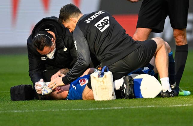 Angelo Stiller TSG 1899 Hoffenheim 13 Injury Injured On The Ground Attendant TSG 1899 Hoffenheim vs FC Bayern Muenchen FCB 12 03 2022 DFL REGULATES PROHIBIT ANY USE OF PHOTOGRAPHS AS IMAGE SEQUENCES AND OR QUASI VIDEO TSG 1899 Hoffenheim vs FC Bayern Muenchen FCB