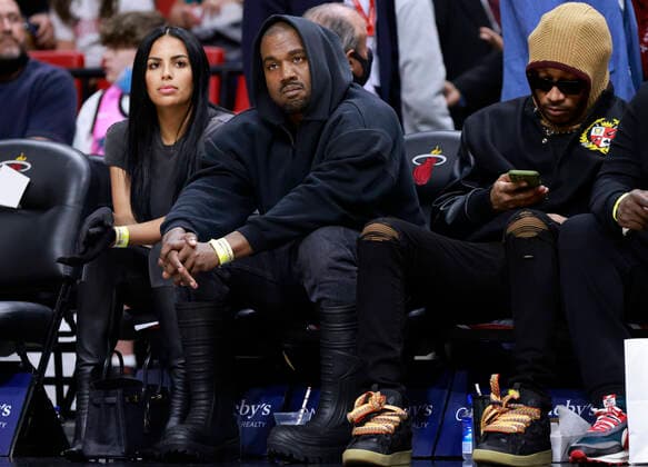 Chaney Jones (L), Kanye West (C) and Future (R) watch from the sidelines during the second half of the NBA, Basketball Herren, USA basketball game between the Miami Heat and the Minnesota Timberwolves at FTX Arena in Miami, Florida, USA, 12 March 2022. Minnesota Timberwolves at Miami Heat !ACHTUNG: NUR REDAKTIONELLE NUTZUNG!  Copyright: xRHONAxWISEx AME3047 20220313-1ee0d0bd003d80bacb985002a394234021128122