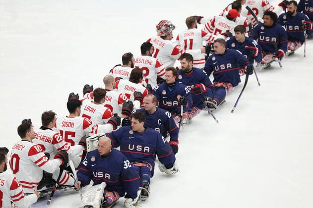 (220313) -- BEIJING, March 13, 2022 -- Players of the United States and Canada greet each other after the Para Ice hockey, Eishockey Gold Medal Game between the United States and Canada of the Beijing 2022 Paralympic Winter games, Winterspiele,Spiele, Summer games at National Indoor Stadium in Beijing, capital of China, March 13, 2022. ) (SP)CHINA-BEIJING-WINTER PARALYMPICS-PARA ICE HOCKEY-GOLD MEDAL GAME-USA VS CAN (CN) ZhangxKeren 