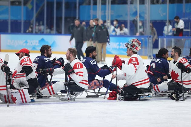 (220313) -- BEIJING, March 13, 2022 -- Players of the United States and Canada greet each other after the Para Ice hockey, Eishockey Gold Medal Game between the United States and Canada of the Beijing 2022 Paralympic Winter games, Winterspiele,Spiele, Summer games at National Indoor Stadium in Beijing, capital of China, March 13, 2022. ) (SP)CHINA-BEIJING-WINTER PARALYMPICS-PARA ICE HOCKEY-GOLD MEDAL GAME-USA VS CAN (CN) HuxXingyu 