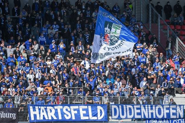Schalke fans waving a big Schalke flag, fans, audience, spectators, atmosphere, stadium, 13 03 2022, Ingolstadt Germany , football, 2 Bundesliga, FC Ingolstadt 04 FC Schalke 04, DFB DFL REGULATES PROHIBIT ANY USE OF PHOTOGRAPHS AS IMAGE SEQUENCES AND OR QUASI VIDEO xslx