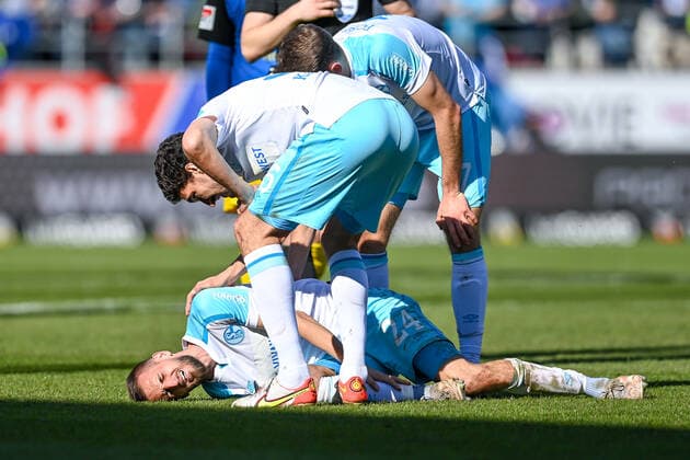 Dominick Drexler Schalke, 24 lying on the ground, racked with pain after a foul, 13 03 2022, Ingolstadt Germany , Football, 2 Bundesliga, FC Ingolstadt 04 FC Schalke 04, DFB DFL REGULATES PROHIBIT ANY USE OF PHOTOGRAPHS AS IMAGE SEQUENCES AND OR QUASI VIDEO xslx