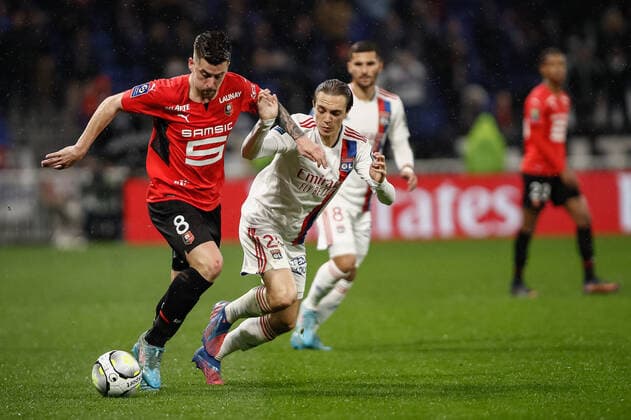 Baptiste Santamaria (Rennes) vs Maxence Caqueret (Olympique Lyonnais) FOOTBALL : Olympique Lyonnais vs Stade Rennais - Ligue 1 Uberteat - 13 03 2022 AurelienMorissard Panoramic 