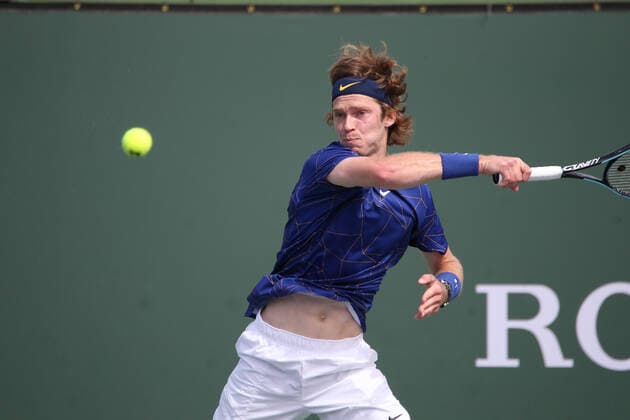 INDIAN WELLS, CA - MARCH 13: Andrey Rublev hits a forehand during the BNP Paribas Open on March 12, 2022 at Indian Wells Tennis Garden in Indian Wells, CA. (Photo by George Walker Icon Sportswire) TENNIS: MAR 13 BNP Paribas Open Icon220313017