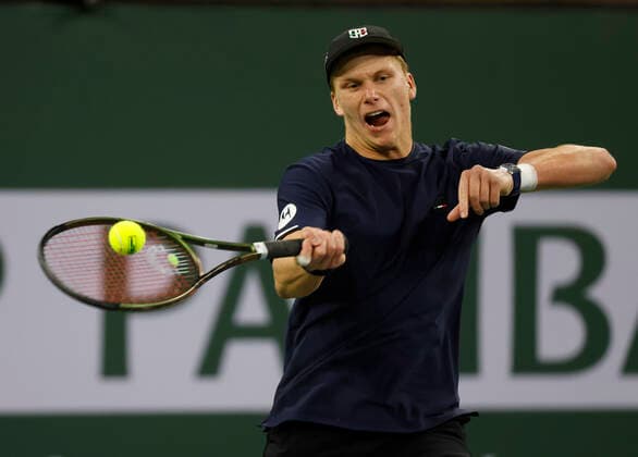 March 14, 2022 Jenson Brooksby returns a shot against Stefanos Tsitsipas of Greece during the 2022 BNP Paribas Open at Indian Wells Tennis Garden in Indian Wells, California. Mandatory Photo Credit: CSM. Indian Wells United States of America - ZUMAc04_ 20220314_zaf_c04_136 Copyright: xCharlesxBausx