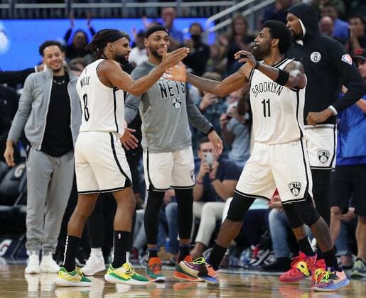 March 15, 2022, Orlando, Florida, USA: The Brooklyn Nets Kyrie Irving (11) celebrates with teammates after scoring against the Orlando Magic at the Amway Center on Tuesday, March 15, 2022, in Orlando, Florida. Irving scored a career-high 60 points as the Nets won, 150-108. Orlando USA - ZUMAm67_ 0152759031st Copyright: xStephenxM.xDowellx