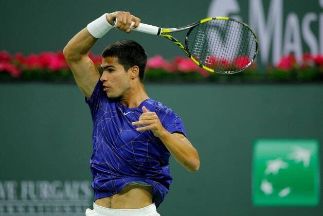 Mandatory Credit: Photo by Ella Ling Shutterstock (12845061ca) Carlos Alcaraz of Spain in action BNP Paribas Open, Tennis, Day 8, Indian Wells Tennis Garden, California, USA - 16 Mar 2022 BNP Paribas Open, Tennis, Day 8, Indian Wells Tennis Garden, California, USA - 16 Mar 2022  Copyright: xEllaxLing Shutterstockx 12845061ca
