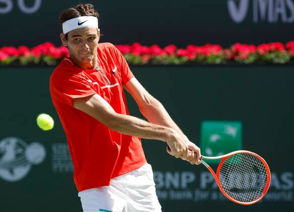 March 16, 2022 Taylor Fritz returns a shot against Alex De Minaur of Australia during the 2022 BNP Paribas Open at Indian Wells Tennis Garden in Indian Wells, California. Mandatory Photo Credit: CSM. Indian Wells United States of America - ZUMAc04_ 20220316_zaf_c04_108 Copyright: xCharlesxBausx