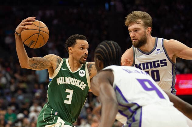 March 16, 2022, Sacramento, CA, USA: Milwaukee Bucks guard George Hill (3) drives by Sacramento Kings forward Justin Holiday (9) and Sacramento Kings forward Domantas Sabonis (10) during a game at the Golden 1 Center in Sacramento, Wednesday, March 16, 2022. Sacramento USA - ZUMAj89_ 20220316_zaf_j89_012 Copyright: xPaulxKitagakixJr.x