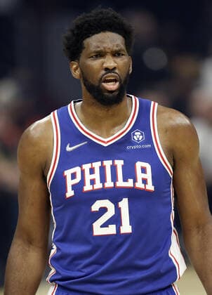 Philadelphia 76ers Joel Embiid (21) reacts after being fouled on a play against the Cleveland Cavaliers at Rocket Mortgage Field House in Cleveland, Ohio on Wednesday, March 16, 2022.  CLE202203161123 AARONxJOSEFCZYK