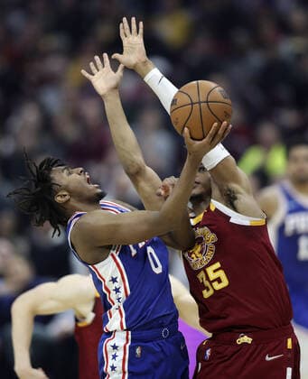 Philadelphia 76ers Tyrese Maxey (0) puts up a shot while defended by Cleveland Cavaliers Isaac Okoro (35) at Rocket Mortgage Field House in Cleveland, Ohio on Wednesday, March 16, 2022.  CLE202203161117 AARONxJOSEFCZYK
