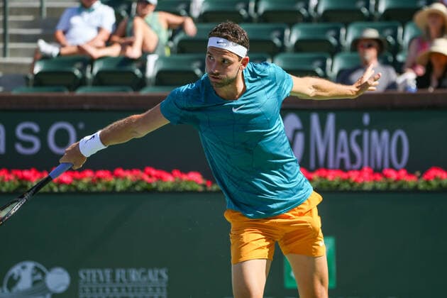 INDIAN WELLS, CA - MARCH 16: Grigor Dimitrov (BUL) hits a backhand during the BNP Paribas Open on March 16, 2022 at Indian Wells Tennis Garden in Indian Wells, CA. (Photo by George Walker Icon Sportswire) TENNIS: MAR 16 BNP Paribas Open Icon220316069