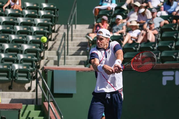 INDIAN WELLS, CA - MARCH 16: John Isner (USA) hits a backhand during the BNP Paribas Open on March 16, 2022 at Indian Wells Tennis Garden in Indian Wells, CA. (Photo by George Walker Icon Sportswire) TENNIS: MAR 16 BNP Paribas Open Icon220316070