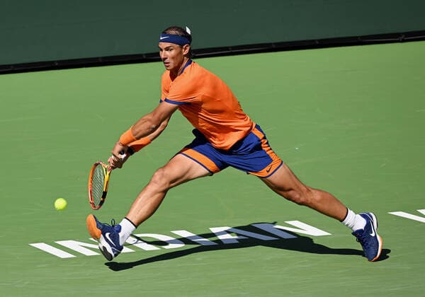 INDIAN WELLS, CA - MARCH 16: Rafael Nadal of Spain chases after and returns the ball during a tennis match played on March 16, 2022 at the BNP Paribas Open at the Indian Wells Tennis Garden in Indian Wells, CA. (Photo by John Cordes Icon Sportswire) TENNIS: MAR 16 BNP Paribas Open Icon506220316029