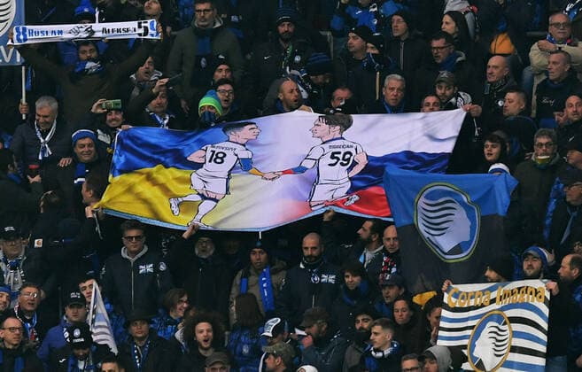 Football, UEFA Europa League, Men, Season 2021 2022, Round of 16, BayArena Leverkusen, Bayer Leverkusen red Atalanta Bergamo white flag in the guest block to Russia Ukraine war UEFA REGULATES PROHIBIT ANY USE OF PHOTOGRAPHS AS IMAGE SEQUENCES AND OR QUASI VIDEO