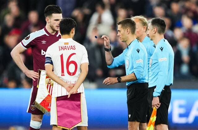 Mandatory Credit: Photo by Jed Leicester Shutterstock (12853355w) referee Clement Turpin tosses the coin as Declan Rice of West Ham United and Jesus Navas of Sevilla look on West Ham United v Sevilla, UEFA Europa League, Round of 16, 2nd Leg, Football, The London Stadium, London, UK - 17 Mar 2022 West Ham United v Sevilla, UEFA Europa League, Round of 16, 2nd Leg, Football, The London Stadium, London, UK - 17 Mar 2022 Copyright: xJedxLeicester Shutterstockx 12853355w