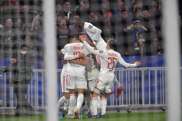 Joie de Moussa Dembele (lyon) et ses coequipiers FOOTBALL: Olympique Lyonnais vs FC Porto - Ligue Europa - 17 03 2022 FredericChambert Panoramic 