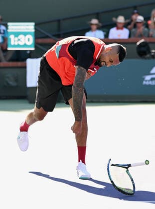 INDIAN WELLS, CA - MARCH 17: Nick Kyrgios of Australia throws and breaks his tennis racquet in a tennis match played on March 17, 2022 during the BNP Paribas Open at the Indian Wells Tennis Garden in Indian Wells, CA. (Photo by John Cordes Icon Sportswire) TENNIS: MAR 17 BNP Paribas Open Icon506220317224