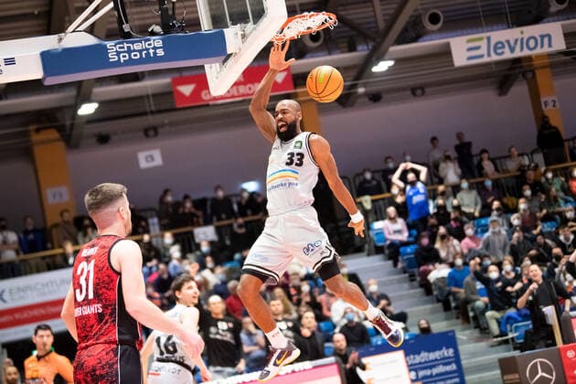 BARMER 2 Basketsball Bundesliga ProA season 2021 2022 30 matchday on 19 3 22 Medipolis SC Jena vs Bayer Giants Leverkusen center Brandon Thomas Jena cheers dunking Sparkassen Arena