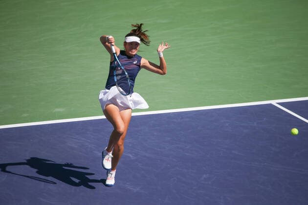 INDIAN WELLS, CA - MARCH 19: Zhaoxuan Yang (CHN) hits an overhead during the doubles final of the BNP Paribas Open on March 19, 2022 at Indian Wells Tennis Garden in Indian Wells, CA. (Photo by George Walker Icon Sportswire) TENNIS: MAR 19 BNP Paribas Open Icon220319003