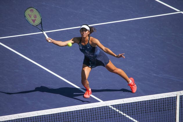 INDIAN WELLS, CA - MARCH 19: Ena Shibahara (JPN) hits a volley during the doubles final of the BNP Paribas Open on March 19, 2022 at Indian Wells Tennis Garden in Indian Wells, CA. (Photo by George Walker Icon Sportswire) TENNIS: MAR 19 BNP Paribas Open Icon220319007