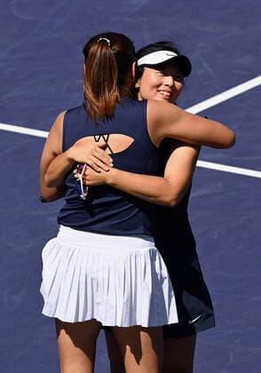 INDIAN WELLS, CA - MARCH 19: Yifan Xu of China hugs her doubles partner Zhaoxuan Yang of China after the pair defeated Asia Muhammad of the United States and Ena Shibahara of Japan to become the women s doubles champions of the BNP Paribas Open played March 19, 2022 at the Indian Wells Tennis Garden in Indian Wells, CA. (Photo by John Cordes Icon Sportswire) TENNIS: MAR 19 BNP Paribas Open Icon506220319009