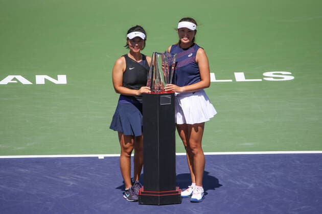 INDIAN WELLS, CA - MARCH 19: Yifan Xu and Zhaoxuan Yang of China pose with the trophy after winning the doubles championship of the BNP Paribas Open on March 19, 2022 at Indian Wells Tennis Garden in Indian Wells, CA. (Photo by George Walker Icon Sportswire) TENNIS: MAR 19 BNP Paribas Open Icon220319013