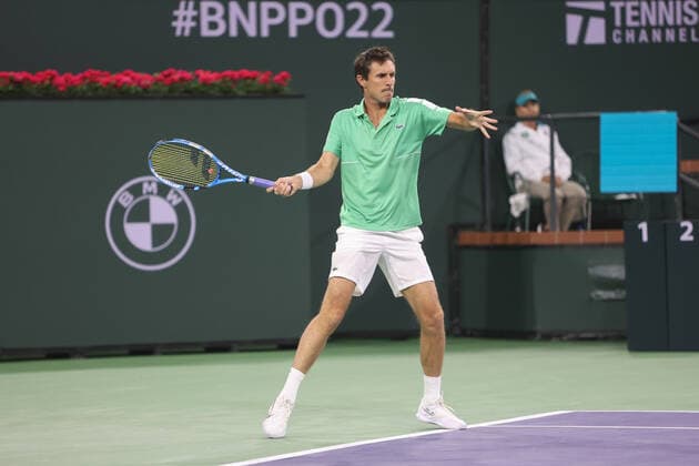 INDIAN WELLS, CA - MARCH 19: Edouard Roger-Vasselin (FRA) hits a forehand during the doubles final of the BNP Paribas Open on March 19, 2022 at Indian Wells Tennis Garden in Indian Wells, CA. (Photo by George Walker Icon Sportswire) TENNIS: MAR 19 BNP Paribas Open Icon220319066