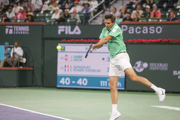 INDIAN WELLS, CA - MARCH 19: Edouard Roger-Vasselin (FRA) hits a backhand during the doubles final of the BNP Paribas Open on March 19, 2022 at Indian Wells Tennis Garden in Indian Wells, CA. (Photo by George Walker Icon Sportswire) TENNIS: MAR 19 BNP Paribas Open Icon220319080
