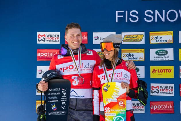 SNOWBOARDING - FIS WC Berchtesgaden BERCHTESGADEN,GERMANY,20.MAR.22 - SNOWBOARDING - FIS World Cup, mixed team event, ladies, men. Image shows Arvid Auner (AUT) and Julia Dujmovits (AUT).  GEPAxpictures xGintarexKarpaviciute