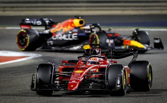 BAHRAIN Charles Leclerc 16 driving the Ferrari in front of Max Verstappen 1 driving the Oracle Red Bull Racing RB18 Honda on track during the Bahrain F1 Grand Prix at the Bahrain International Circuit on March 20, 2022 in Bahrain, Bahrain ANP ROBIN VAN LONKHUIJSEN Bahrain,BAHREIN xVIxANPx xxANPxIVx 445854970 originalFilename: 0153094312st.jpg