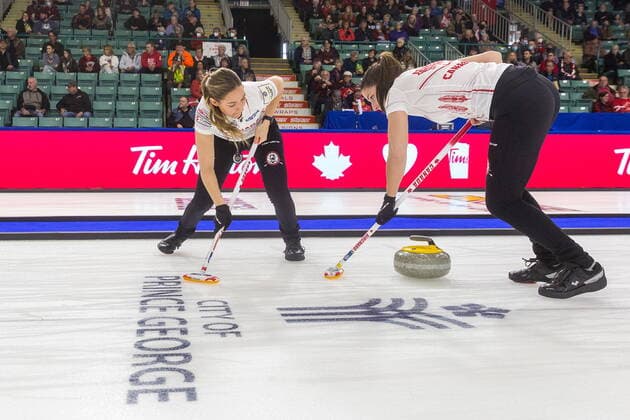 March 20, 2022, Prince George, BC, CANADA: Canada lead Briane Meilleur, left, and second Shannon Birchard sweep in front of a stone at CN Centre on Sunday afternoon at the Womens World Curling in Prince George, B.C., Sunday, March 20, 2022. Canada News - March 20, 2022 - ZUMAc35_ 20220320_zaf_c35_077 Copyright: xJamesxDoylex