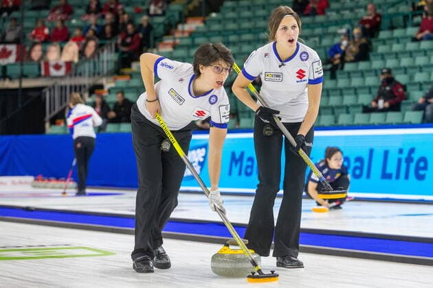 March 20, 2022, Prince George, BC, CANADA: Italy second Angela Romei, left, and third Marta Lo Deserto sweep in front of a stone at CN Centre on Sunday afternoon at the Womens World Curling in Prince George, B.C., Sunday, March 20, 2022. Canada News - March 20, 2022 - ZUMAc35_ 20220320_zaf_c35_073 Copyright: xJamesxDoylex